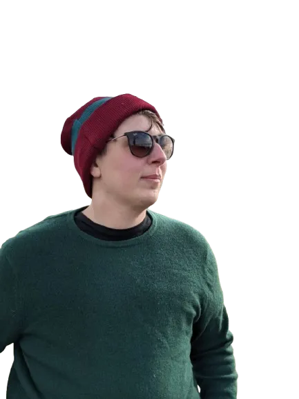Kurt wearing sunglasses and a beanie, gazing into the distance with a relaxed expression